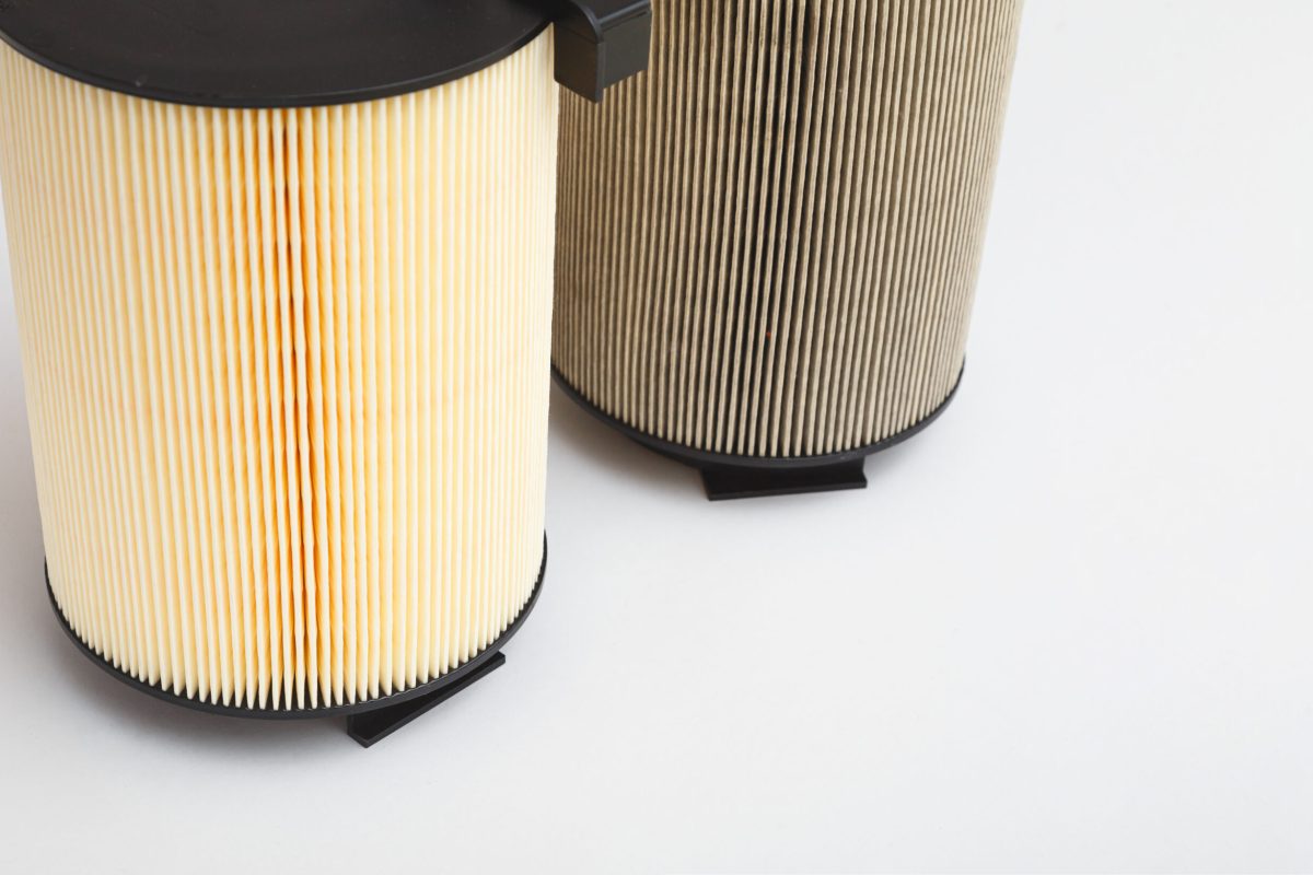 New Clean and Old Dirty Air Filter for a Turbocharged Car Engine on White background. Service time to Replace Parts.